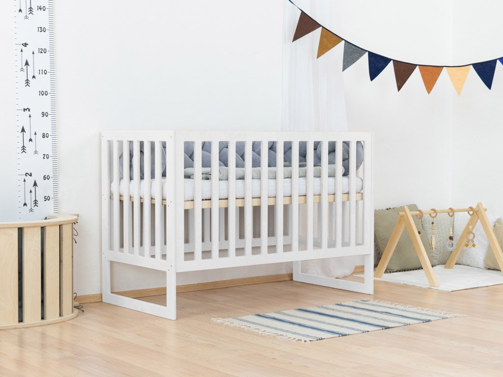 Cama para bebés con bares de pañales