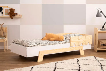 Children's bed with puzzle barriers